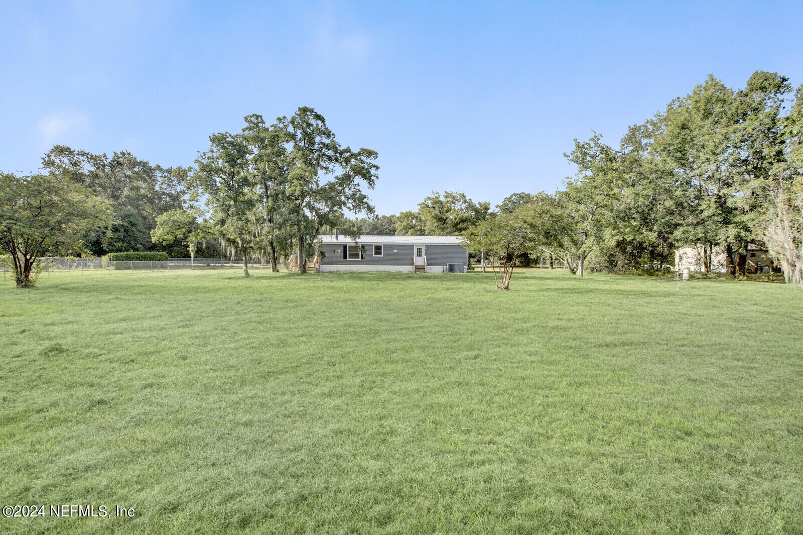 4016 Pinto Road Middleburg, FL 32068 - Photo 8 of 37 a view of a field with trees in the background