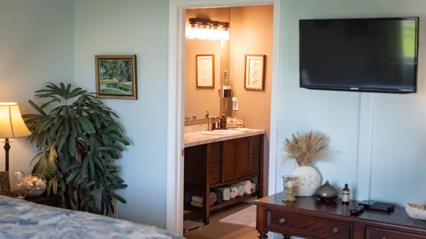 a bathroom with a sink vanity and a mirror