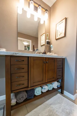 a kitchen with a sink appliances and cabinets