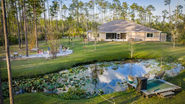a kitchen with stainless steel appliances granite countertop a sink and a stove