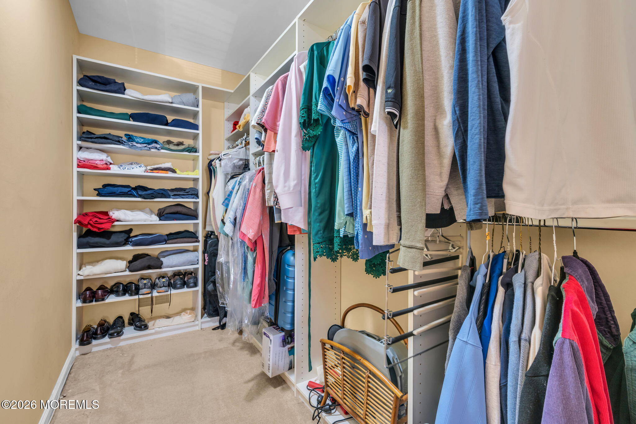 85 Radcliffe Drive Lincroft, NJ 07738 - Photo 14 of 49 a view of walk in closet with clothes and shoes