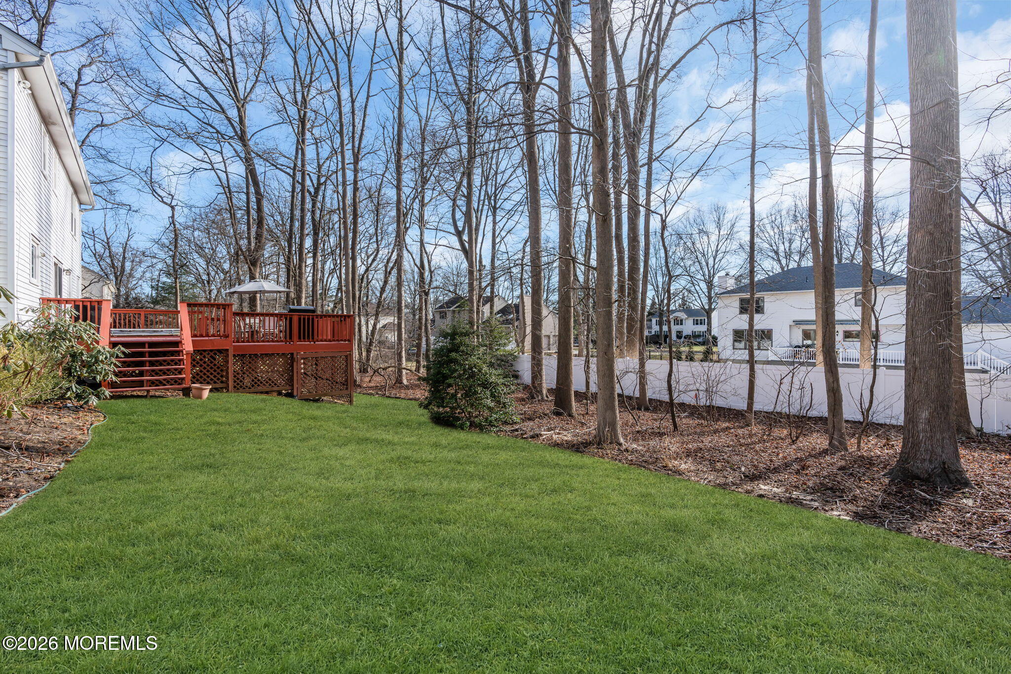 85 Radcliffe Drive Lincroft, NJ 07738 - Photo 15 of 49 a view of a backyard with potted plants and large trees