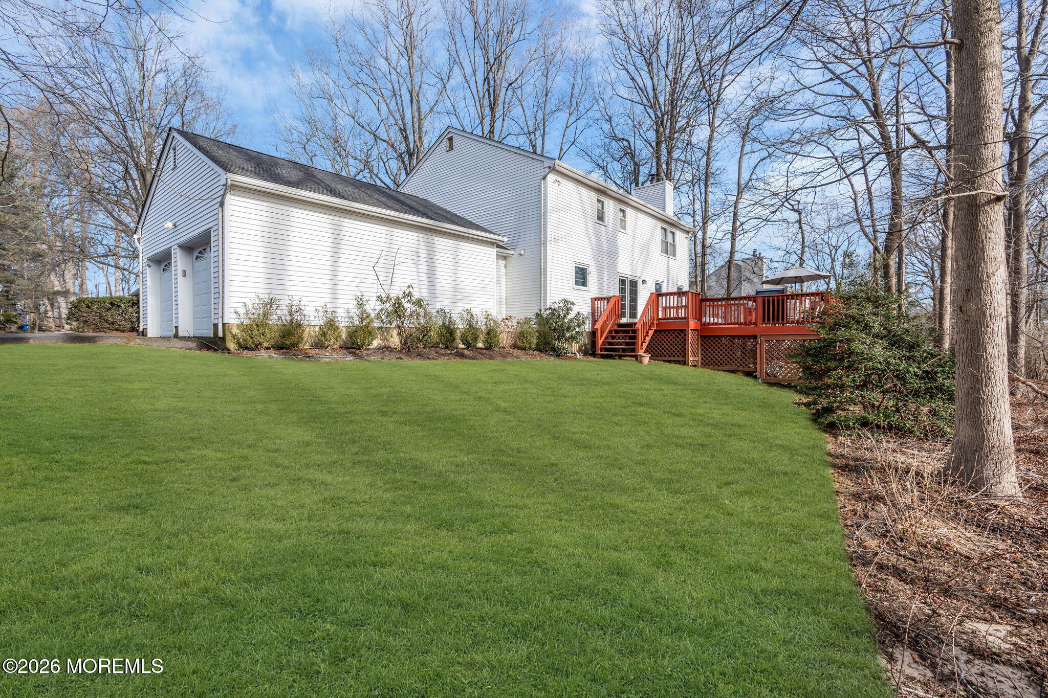 85 Radcliffe Drive Lincroft, NJ 07738 - Photo 16 of 49 a view of a house with a yard