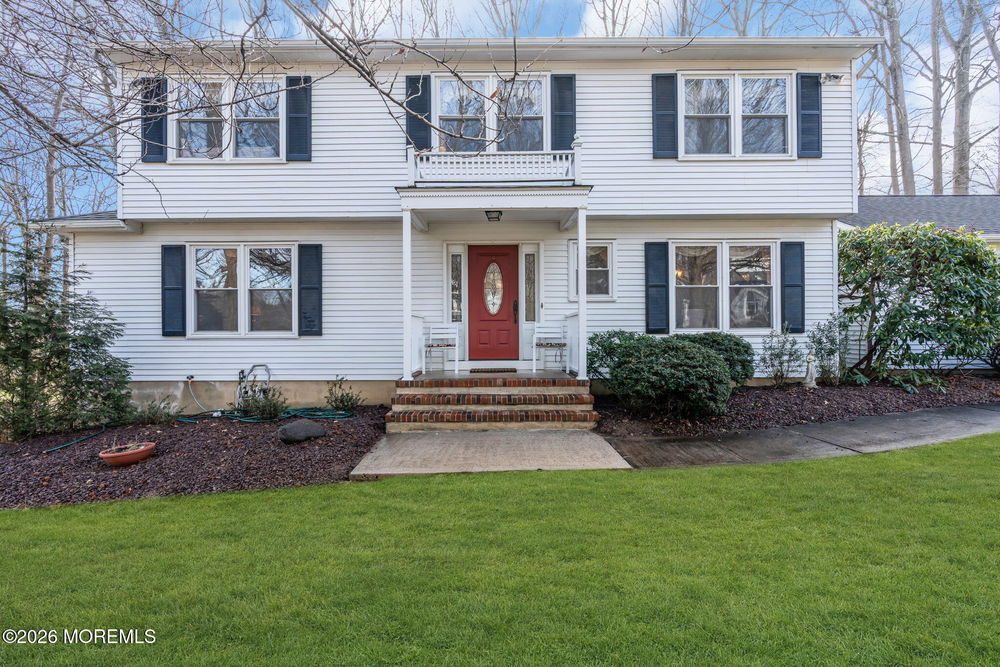 85 Radcliffe Drive Lincroft, NJ 07738 - Photo 21 of 49 a front view of a house with a garden