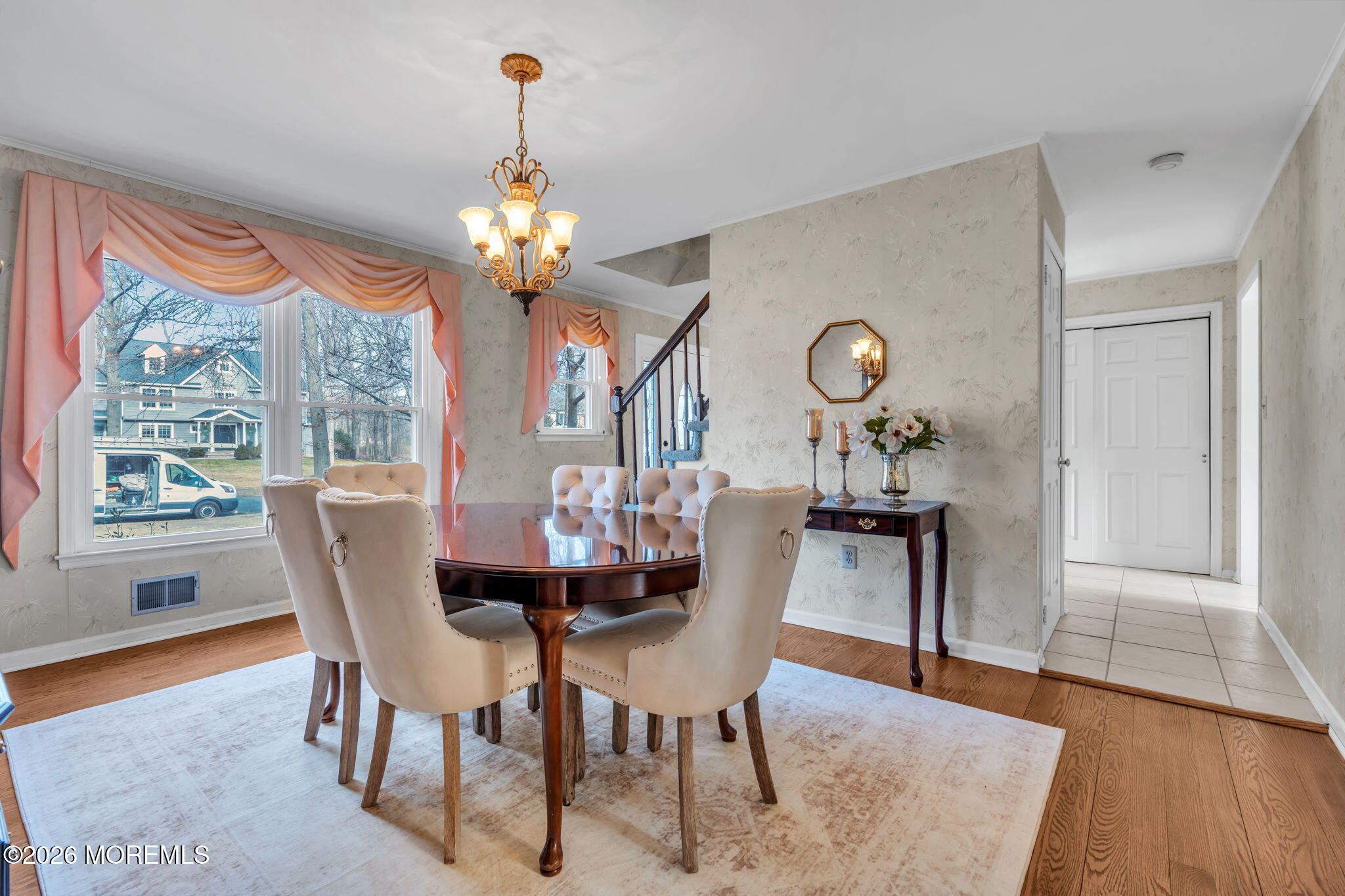 85 Radcliffe Drive Lincroft, NJ 07738 - Photo 27 of 49 a dining room with furniture a chandelier and wooden floor