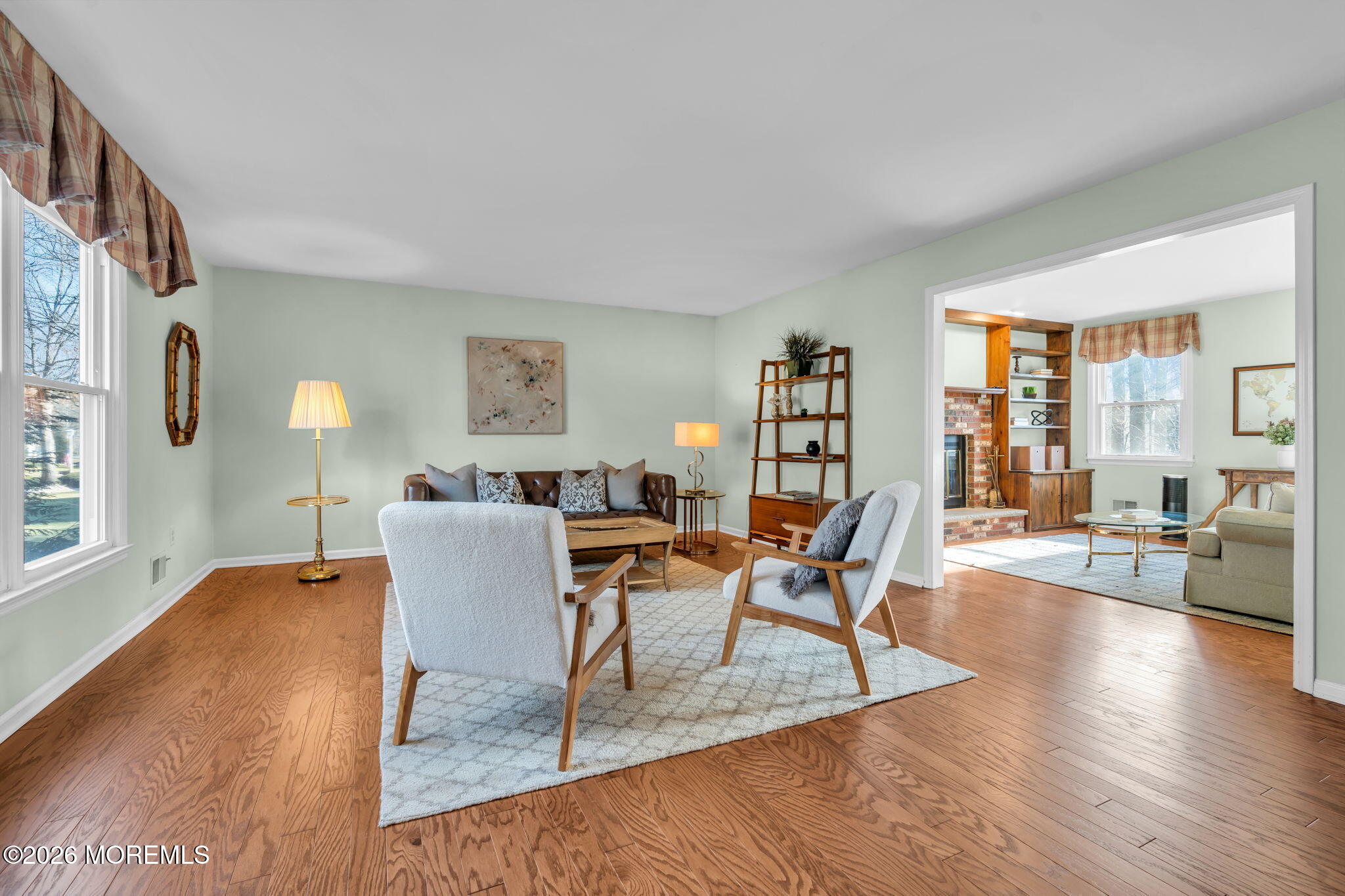 85 Radcliffe Drive Lincroft, NJ 07738 - Photo 29 of 49 a dining room with wooden floor and a floor to ceiling window