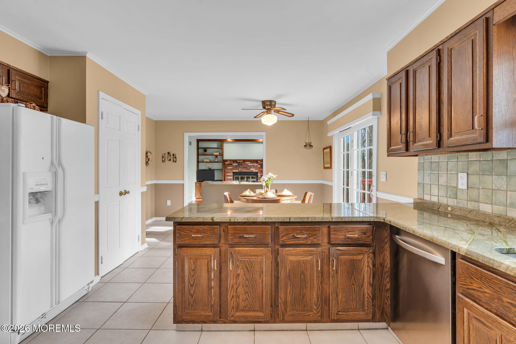 85 Radcliffe Drive Lincroft, NJ 07738 - Photo 43 of 49 a kitchen with stainless steel appliances granite countertop a sink and a wooden cabinets