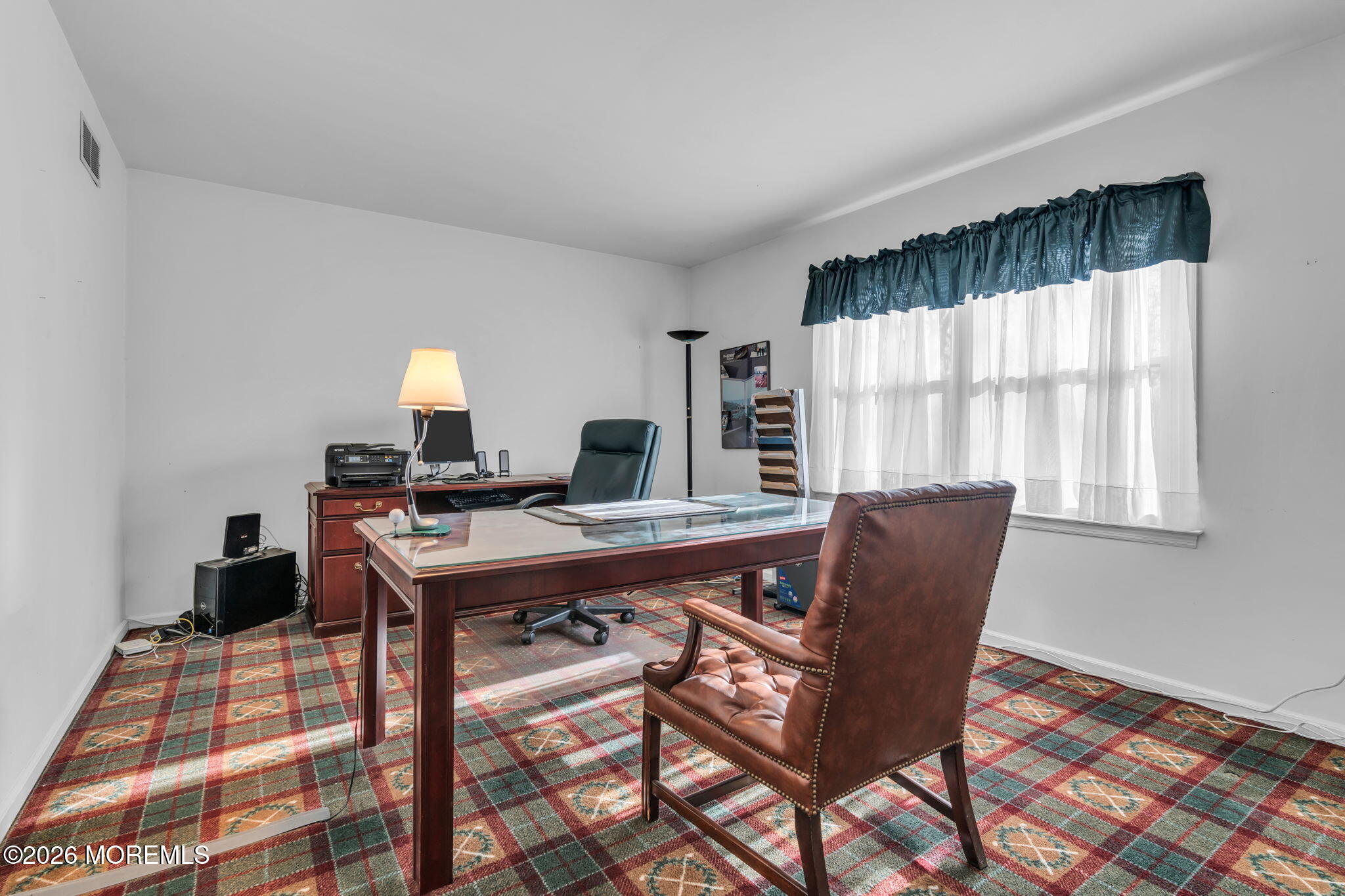 85 Radcliffe Drive Lincroft, NJ 07738 - Photo 5 of 49 a view of a workspace with furniture and a window
