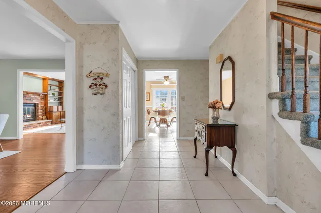 a view of a livingroom with furniture and entryway
