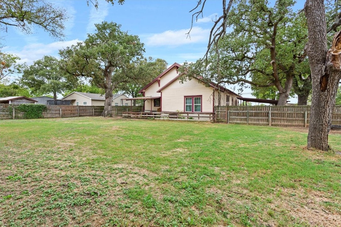 506 East Frederick Street Riesel, TX 76682 - Photo 29 of 30 a view of a house with a yard and sitting area
