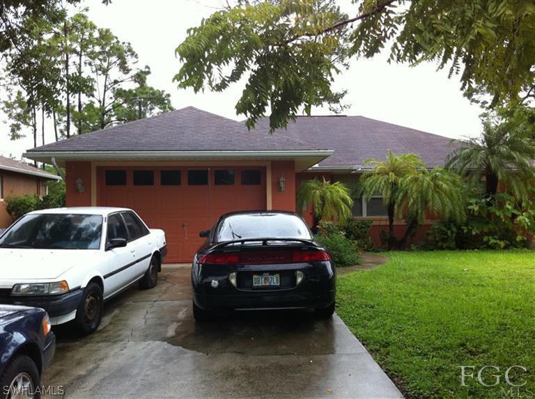 8193 Pelican Road Fort Myers, FL 33967 - Photo 1 of 5 a car parked in front of a house