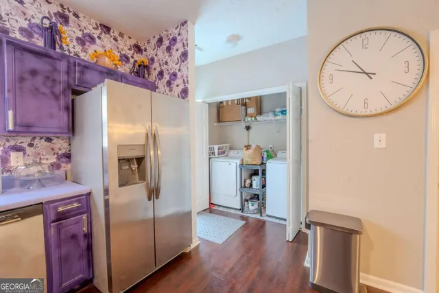 a view of kitchen with furniture and wooden floor