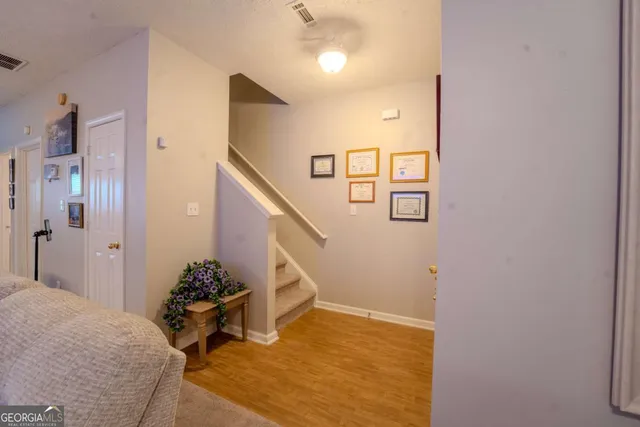 a view of a livingroom with furniture and stairs
