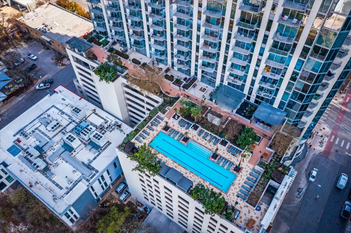 360 Nueces Street, Unit 4203 Austin, TX 78701 - Photo 39 of 40 Drone / aerial view of a pool and apartment complex