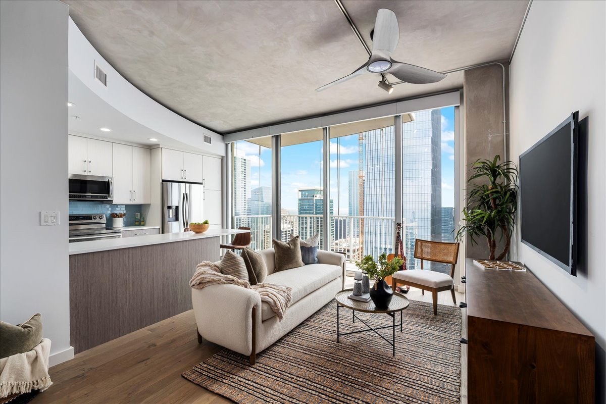 360 Nueces Street, Unit 4203 Austin, TX 78701 - Photo 6 of 40 Living room with floor to ceiling windows, wood floors, and ceiling fan
completely updated with the finest finishes.