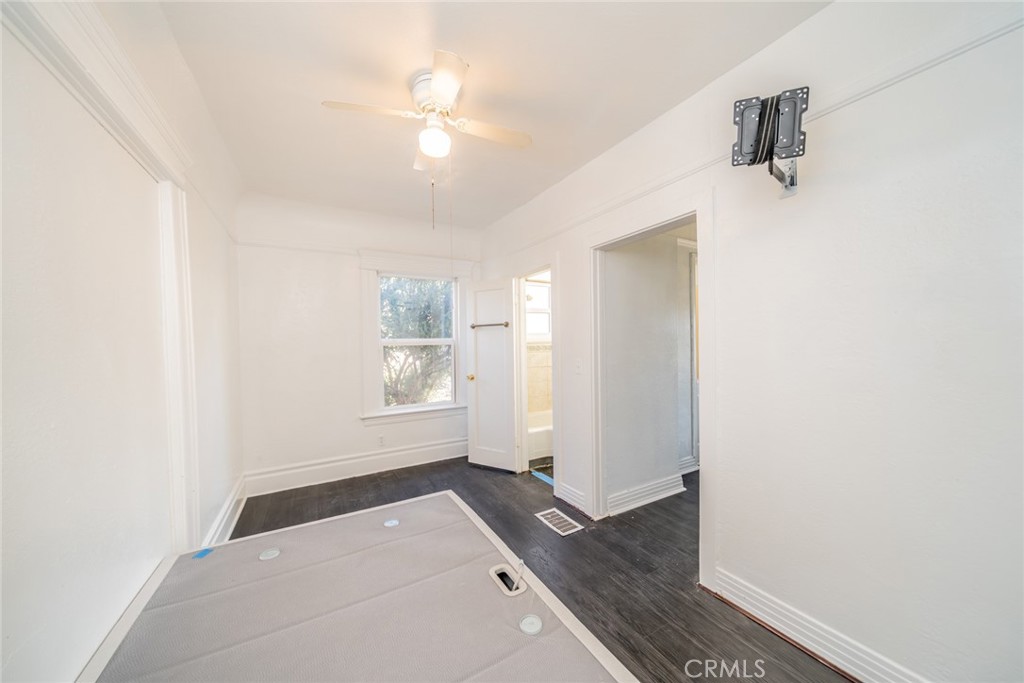 3987 4th Street Riverside, CA 92501 - Photo 11 of 33 a view of empty room with wooden floor and fan