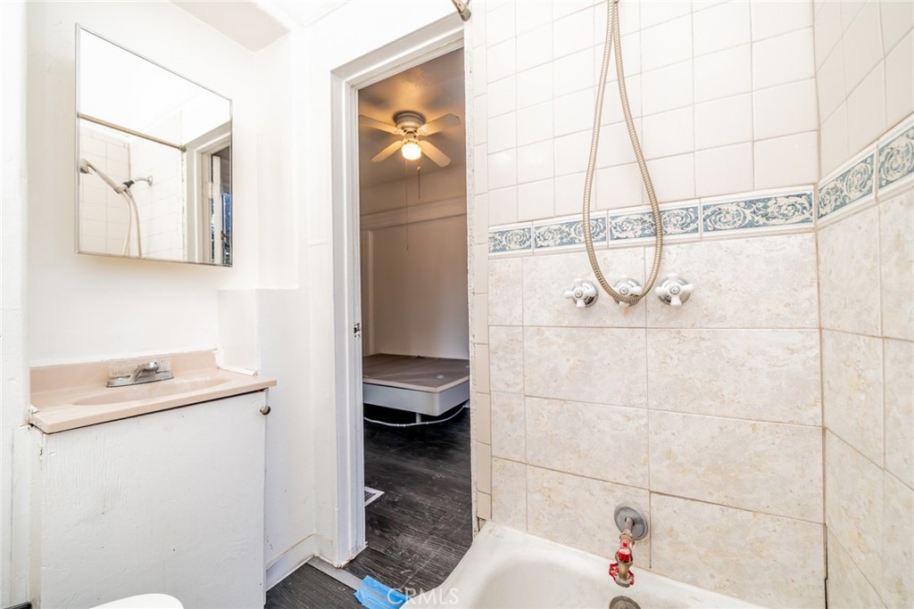 3987 4th Street Riverside, CA 92501 - Photo 13 of 33 a bathroom with a sink and a shower