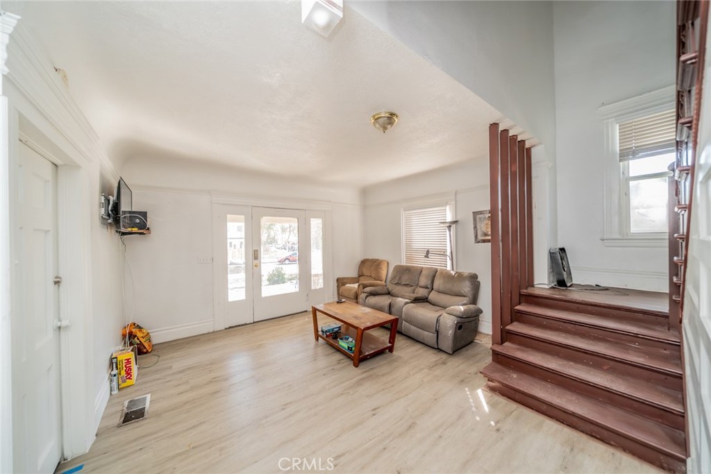3987 4th Street Riverside, CA 92501 - Photo 15 of 33 a living room with furniture and wooden floor