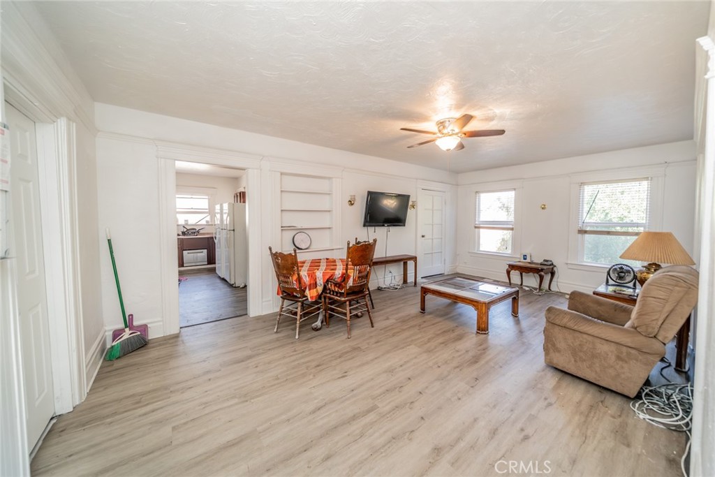 3987 4th Street Riverside, CA 92501 - Photo 20 of 33 a living room with furniture and a wooden floor