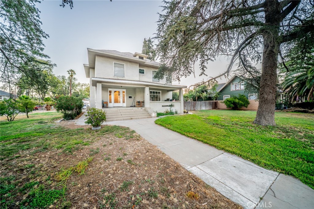 3987 4th Street Riverside, CA 92501 - Photo 2 of 33 a front view of house with yard and green space