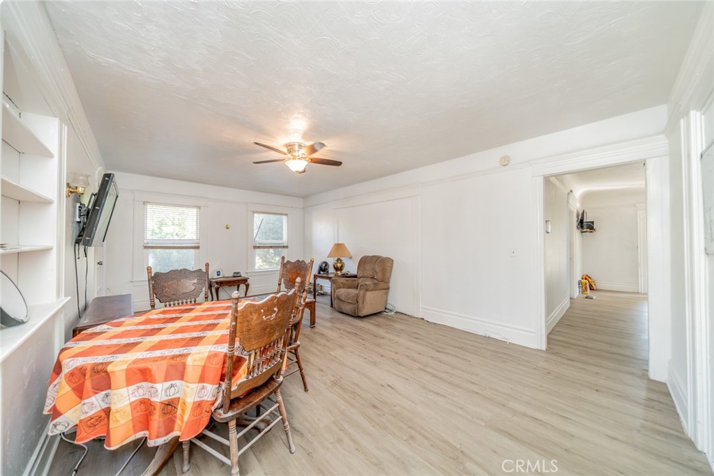 3987 4th Street Riverside, CA 92501 - Photo 21 of 33 a dining room with furniture and wooden floor