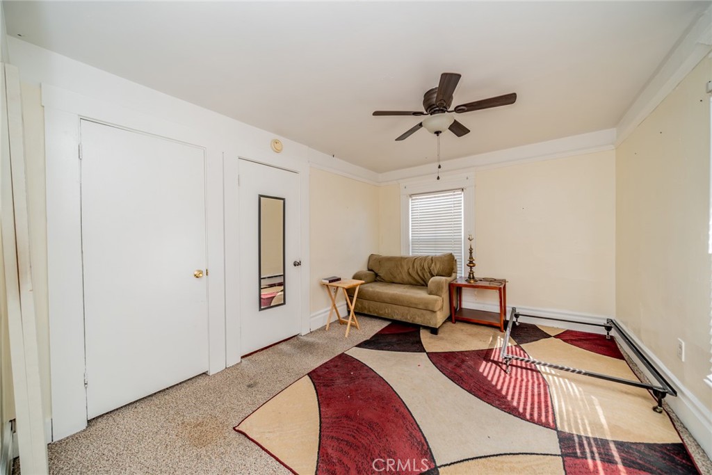 3987 4th Street Riverside, CA 92501 - Photo 22 of 33 a living room with furniture and a window