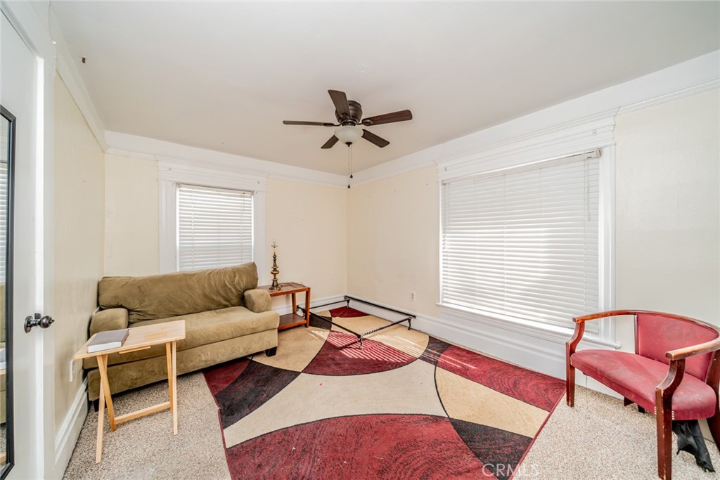3987 4th Street Riverside, CA 92501 - Photo 25 of 33 a living room with furniture and a window