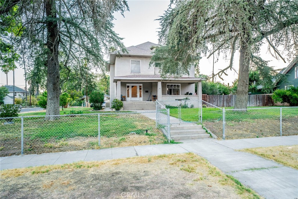 3987 4th Street Riverside, CA 92501 - Photo 28 of 33 a view of a house with a backyard and a tree