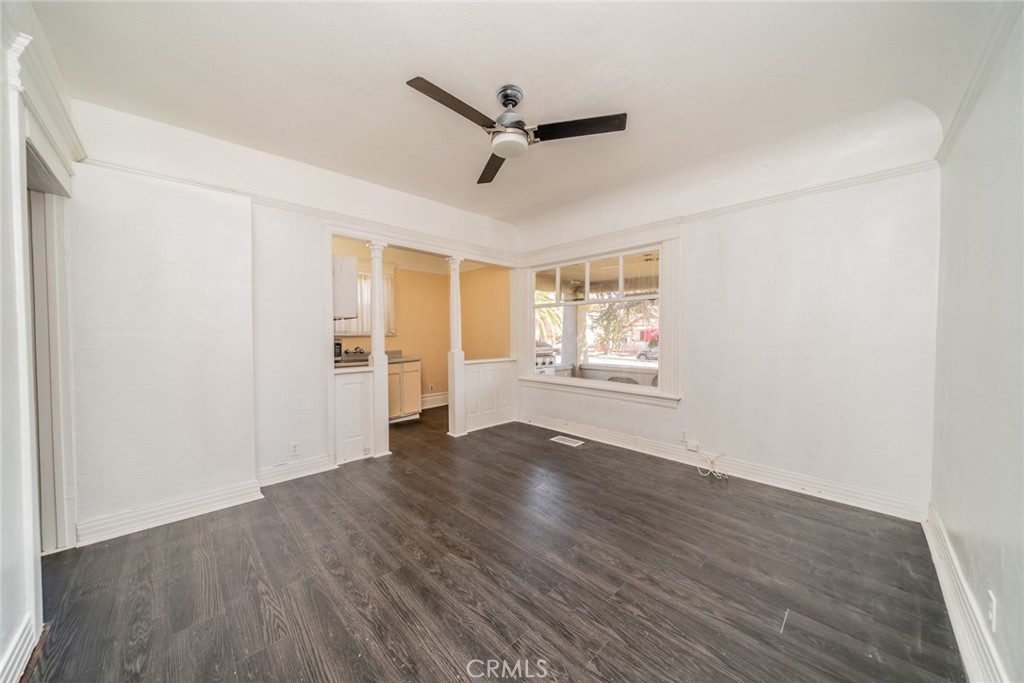 3987 4th Street Riverside, CA 92501 - Photo 7 of 33 a view of an empty room with a window and wooden floor