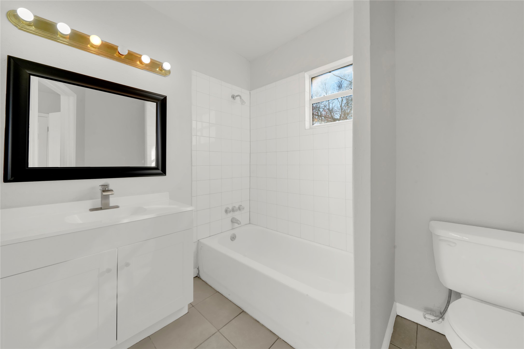 106 Hanover Street Houston, TX 77012 - Photo 48 of 49 a bathroom with a toilet sink and mirror
