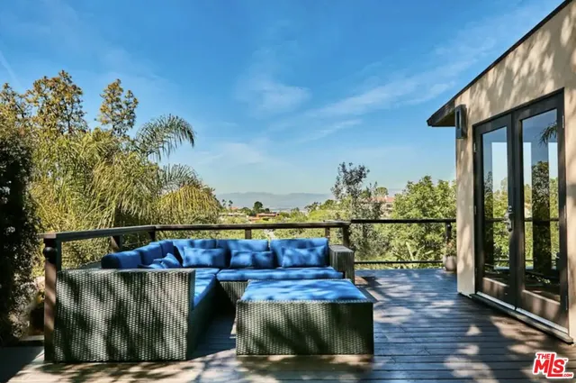 a view of a couches on the roof deck