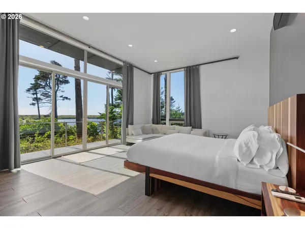 a bedroom with a bed and a couch