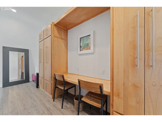 a bathroom with a bathtub sink and mirror
