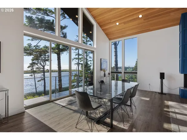 a dining room with furniture and wooden floor