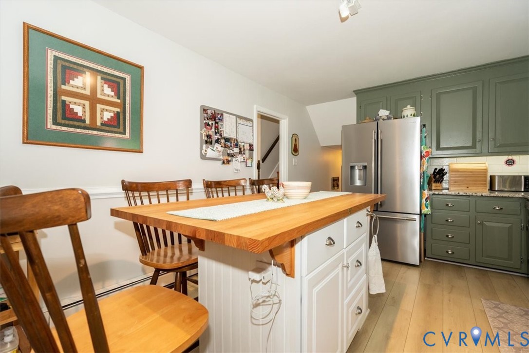 10712 Lunswood Road Chester, VA 23831 - Photo 6 of 31 Kitchen featuring LVP flooring, a kitchen island w