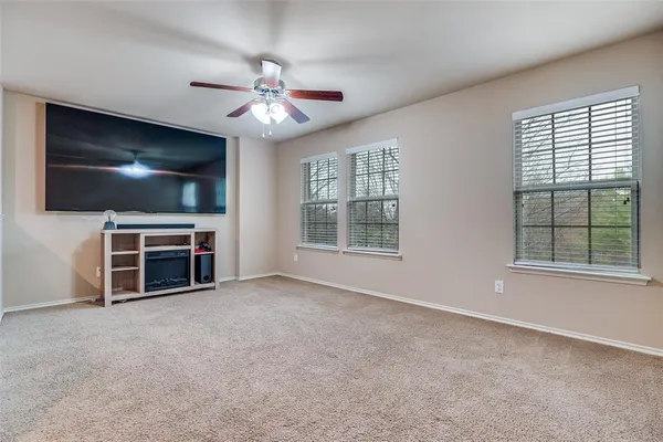 a view of a livingroom with furniture and a flat screen tv