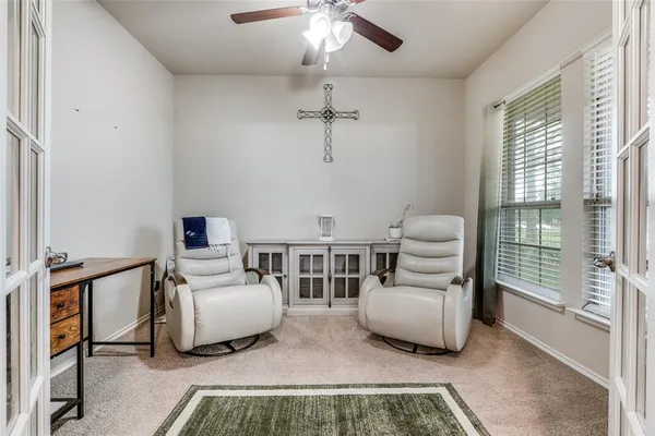 a view of a livingroom with furniture and a flat screen tv