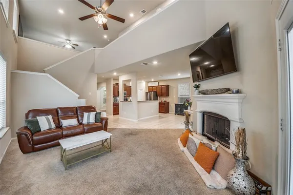 a kitchen with sink cabinets and living room
