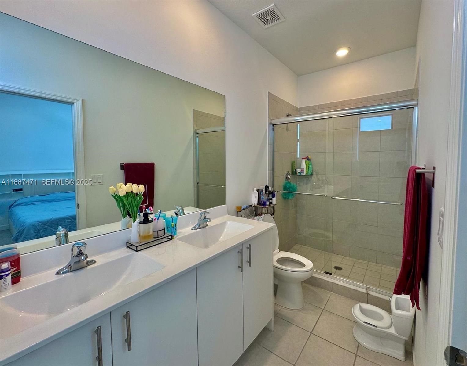 23541 Southwest 127th Place Homestead, FL 33032 - Photo 3 of 13 a bathroom with a sink a toilet and shower