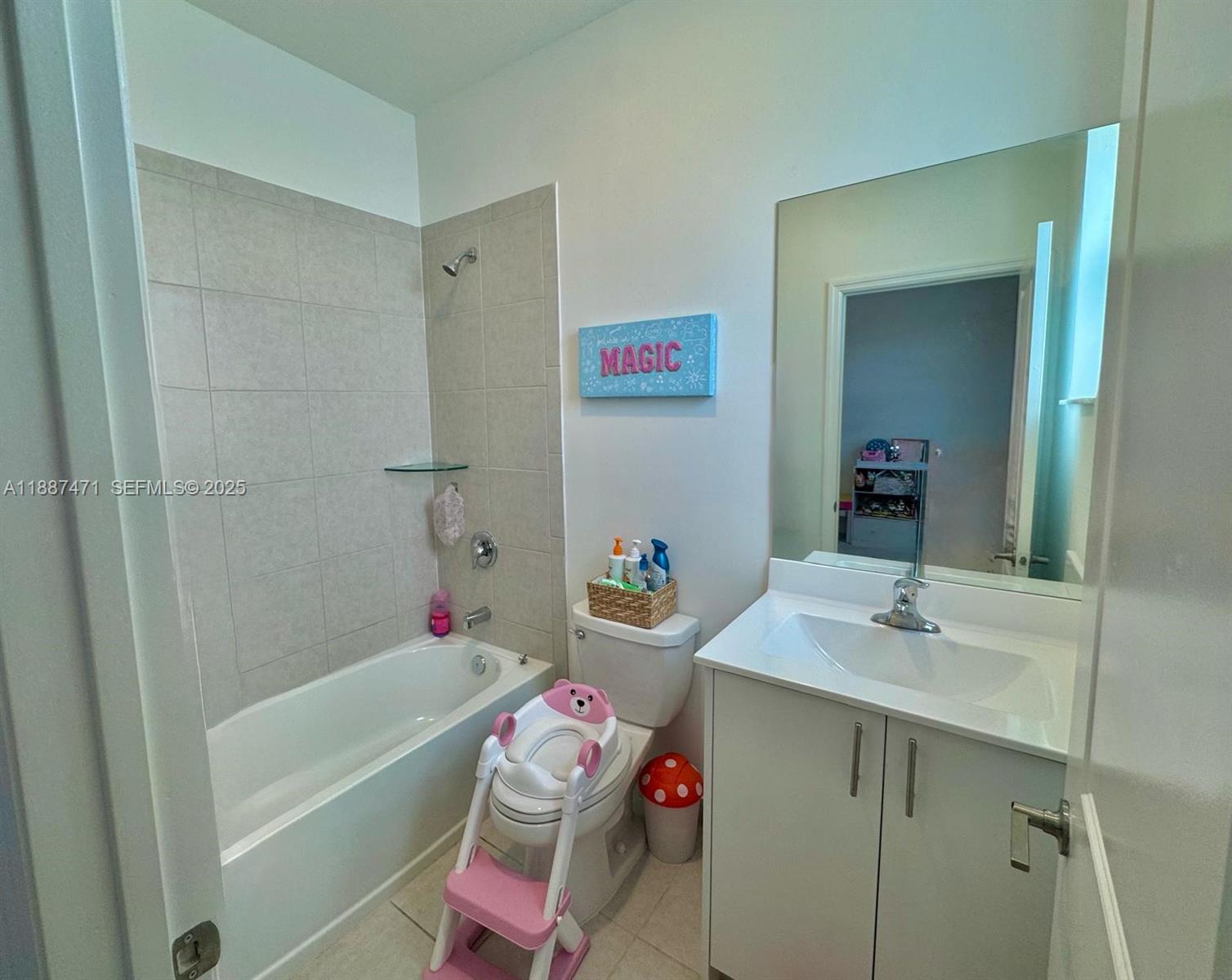 23541 Southwest 127th Place Homestead, FL 33032 - Photo 4 of 13 a bathroom with a sink toilet vanity tub and shower