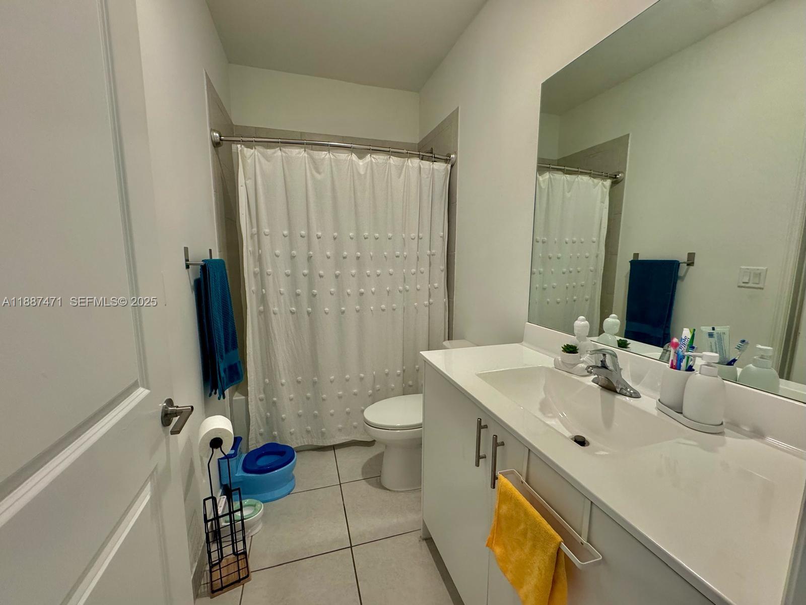 23541 Southwest 127th Place Homestead, FL 33032 - Photo 9 of 13 a bathroom with a sink toilet and shower