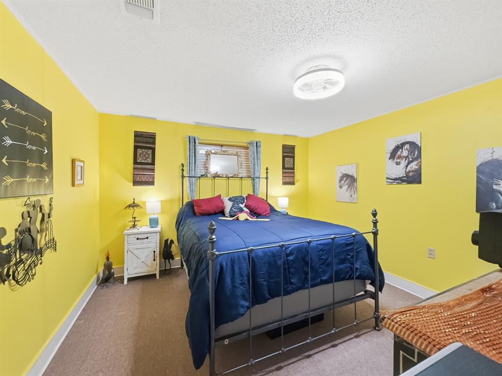 112 East Hoard Street Hamilton, TX 76531 - Photo 9 of 26 a bed room with a bed and a window