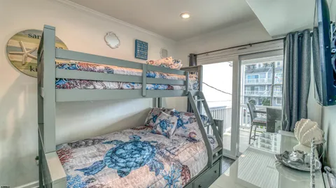 a bedroom with a large bed and a large window