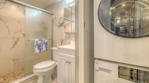a bathroom with a toilet and a mirror