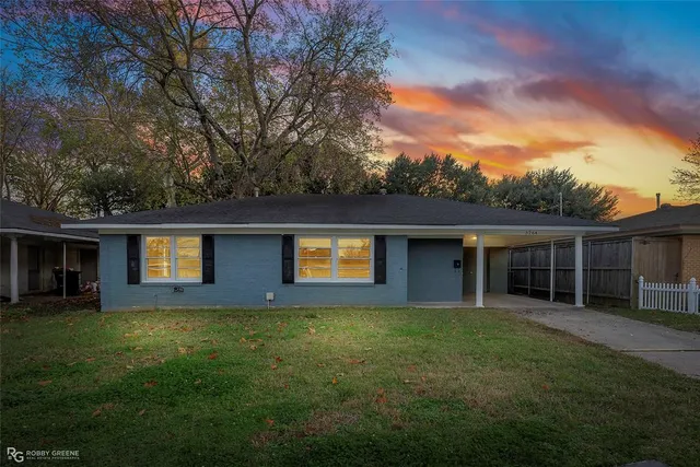 a house view with a garden space