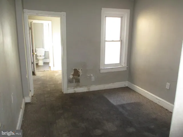 an empty room that has a window