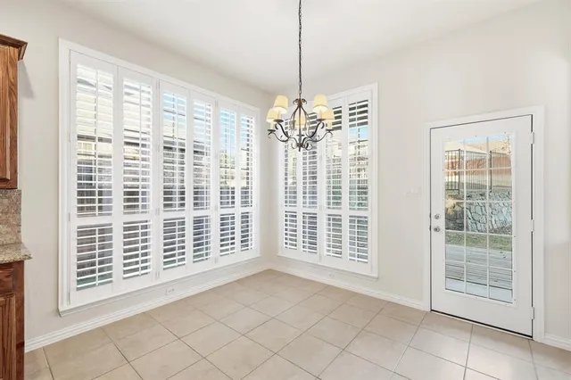 a view of empty room with windows