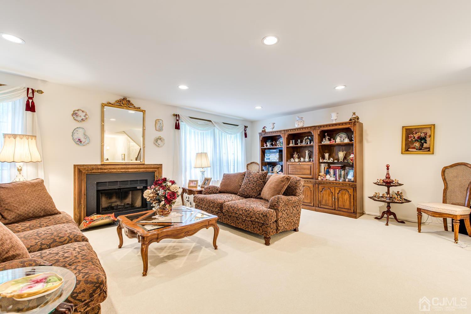4303 Springbrook Drive Edison, NJ 08820 - Photo 13 of 40 a living room with furniture and a fireplace
