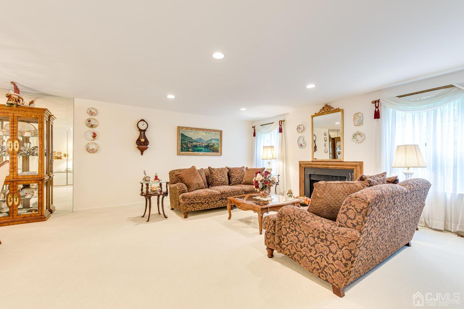 4303 Springbrook Drive Edison, NJ 08820 - Photo 14 of 40 a living room with furniture and a fireplace