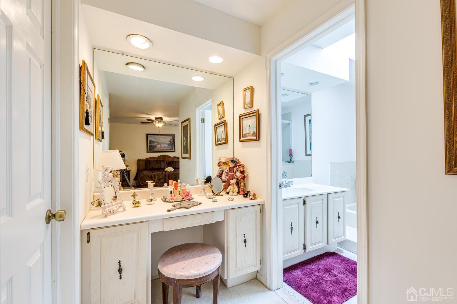 4303 Springbrook Drive Edison, NJ 08820 - Photo 26 of 40 a bathroom with a sink vanity mirror and toilet
